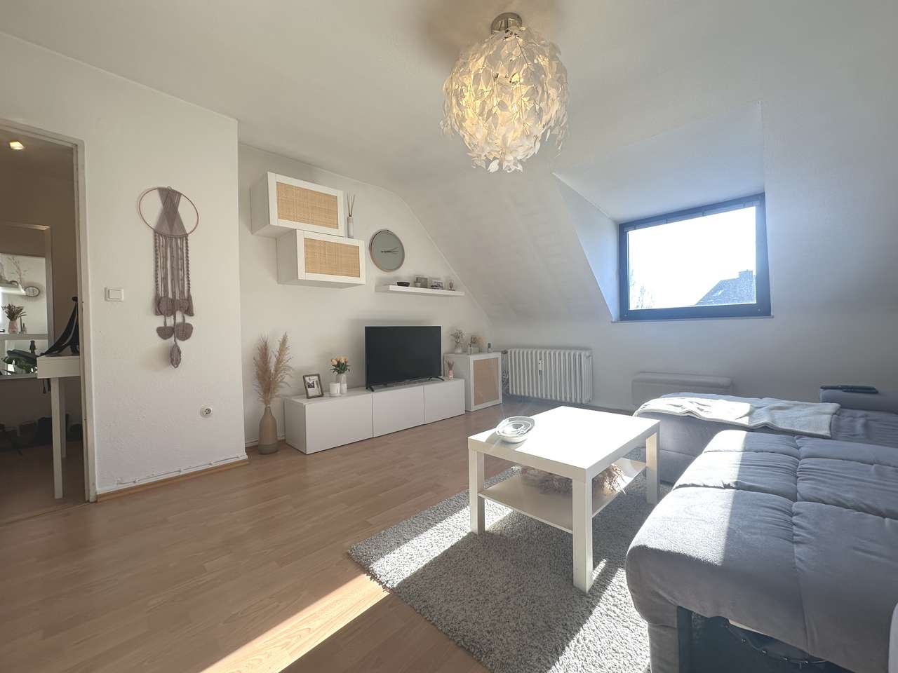 Top-Investment: Vermietete DG-Wohnung mit Garage & flexibler Raumnutzung!